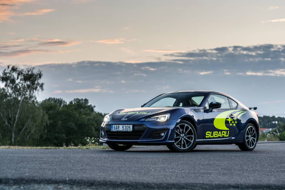 This is a black Subaru BRZ on an asphalt road.