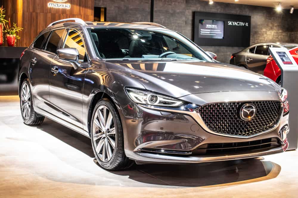 This is a gray 2020 Mazda Mazda6 on display at a car show.