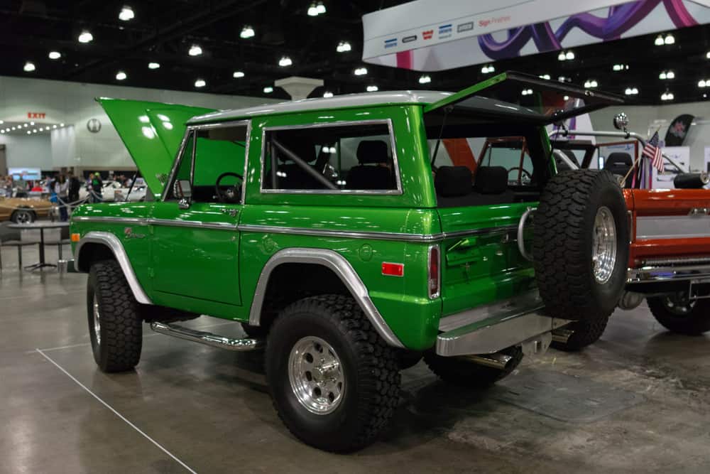 This is a green Ford Bronco Sport on display at a car show.