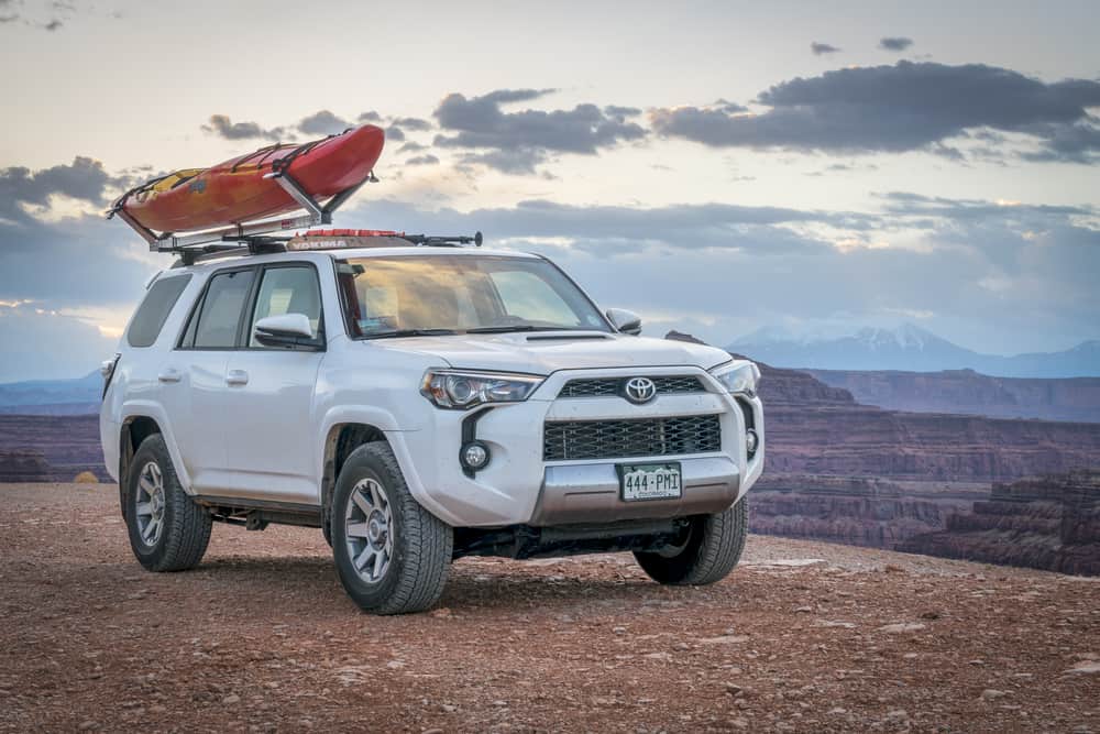 This is a white Toyota 4Runner on a rough road up the mountain.