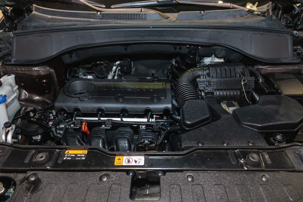 This is a close look at the engine of a Kia Sorento under the hood.