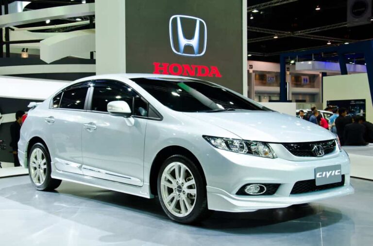 This is a silver Honda Civic on display at a car show.