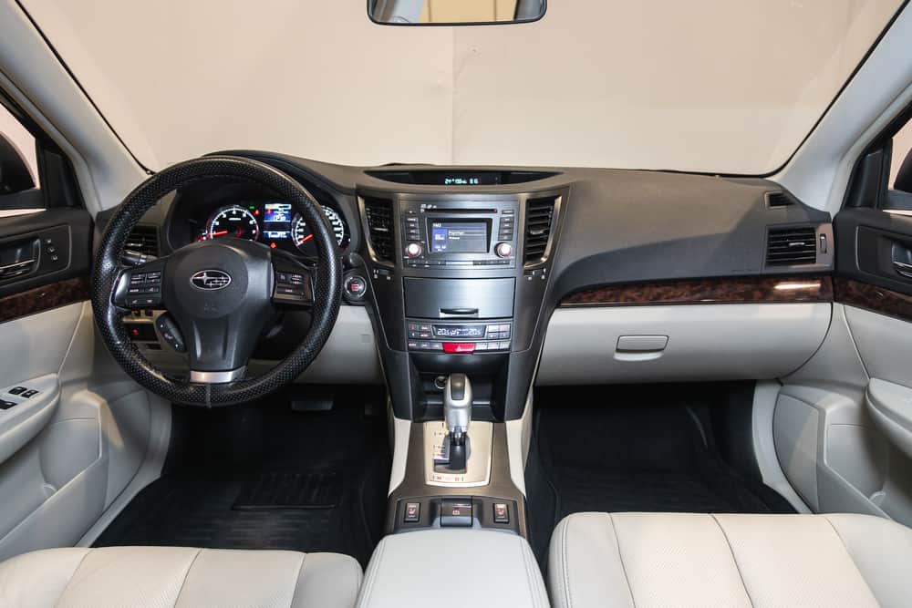 This is a close look at the interior front seats and dashboard of the Subaru outback.