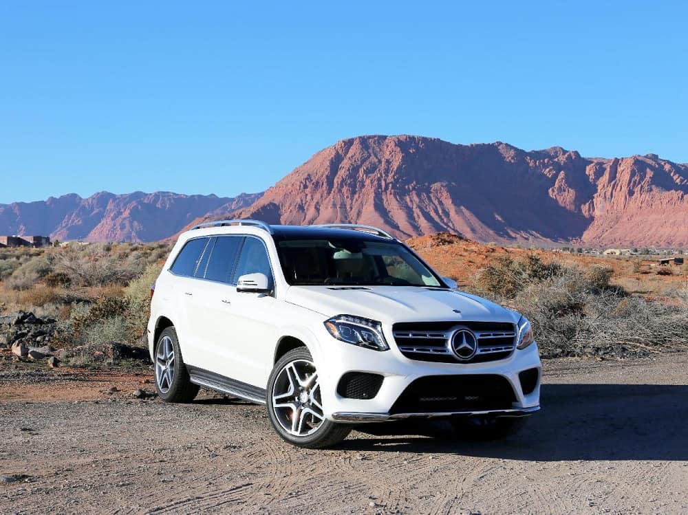 This is a white Mercedes-Benz GLS-Class parked on a dirt road.