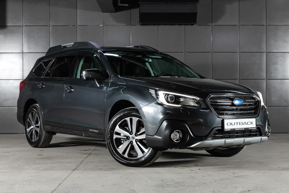 Gray Subaru Outback parked in the garage.