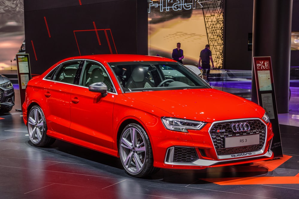 Red Audi RS3 A3 at a car show.