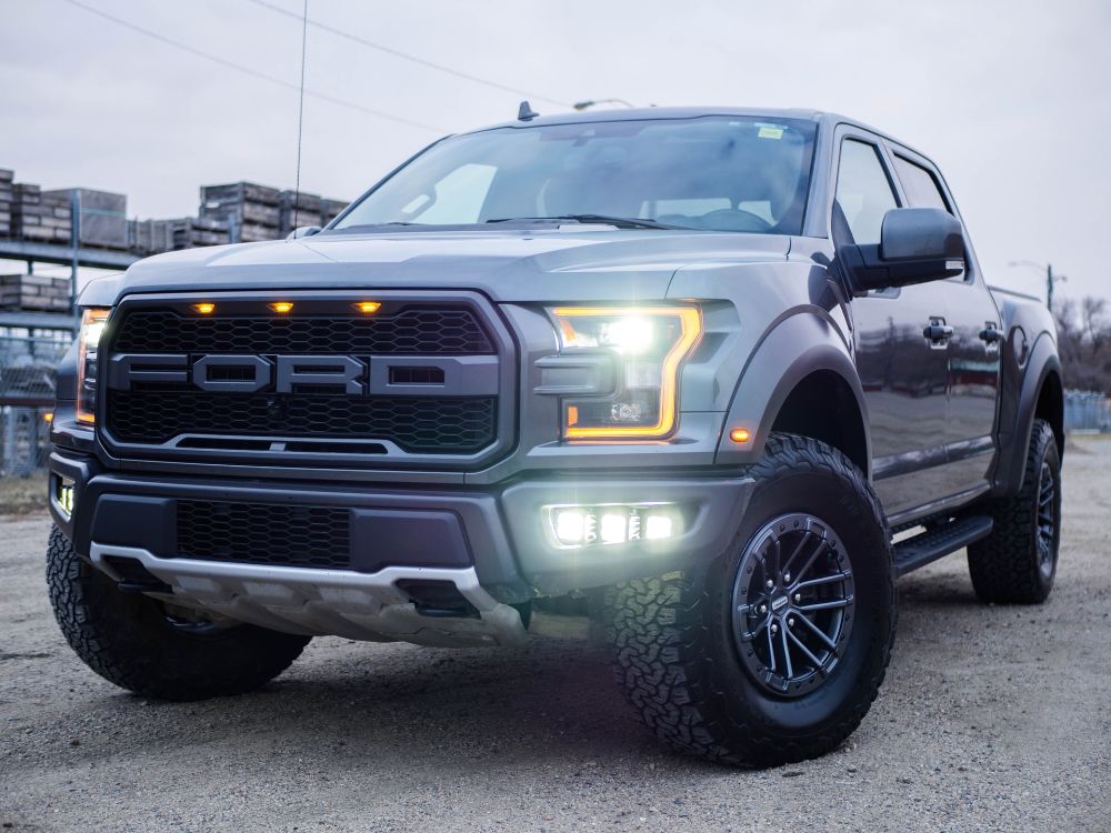 Black ford ranger pickup on a rough surface area.