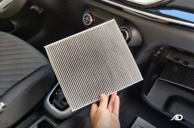 Replacing the cabin air filter inside the car.