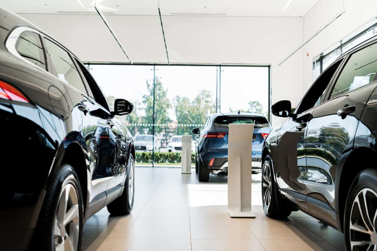 Luxury cars in showroom.