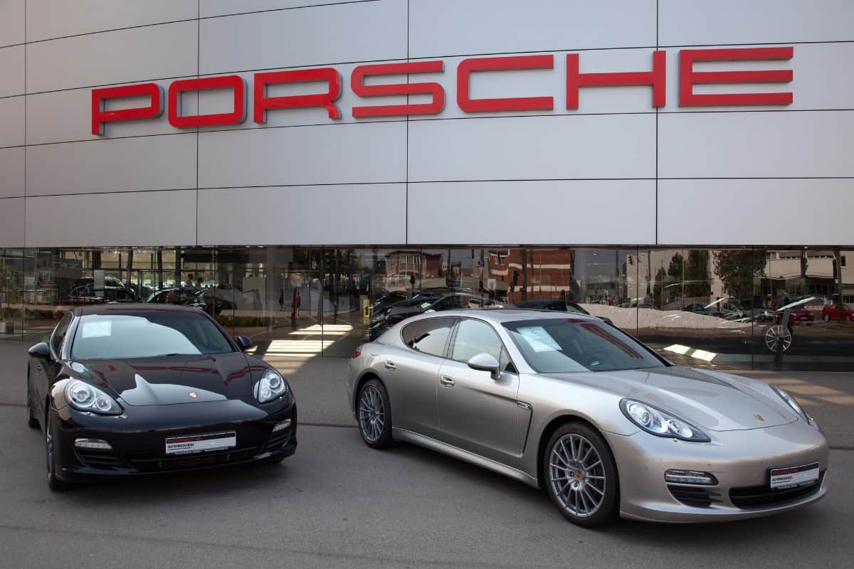 Panamera sports car parked in front of the Porsche store.