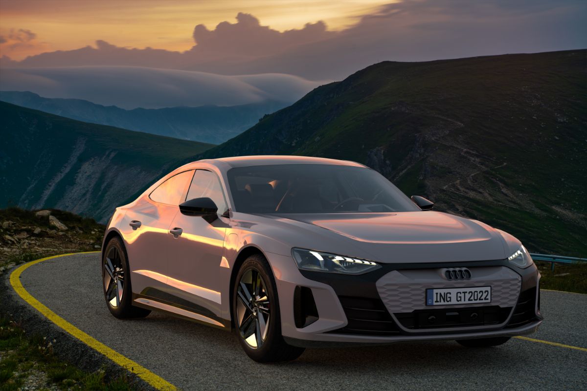 A captivating car on the road with a mountain view.