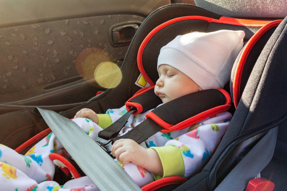 Sleeping baby in a car safety seat.