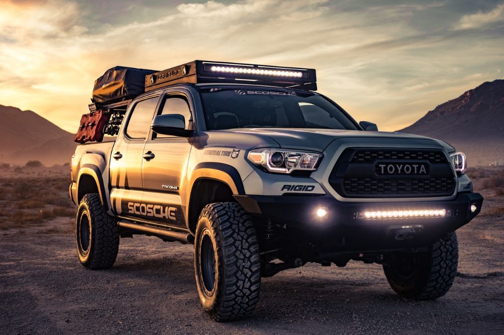 Black Toyota Tundra on mountain hill  with heavy loads.