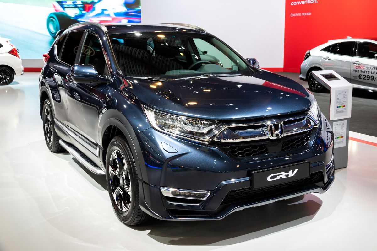 Front view of blue Honda CR-V Hybrid on car show.