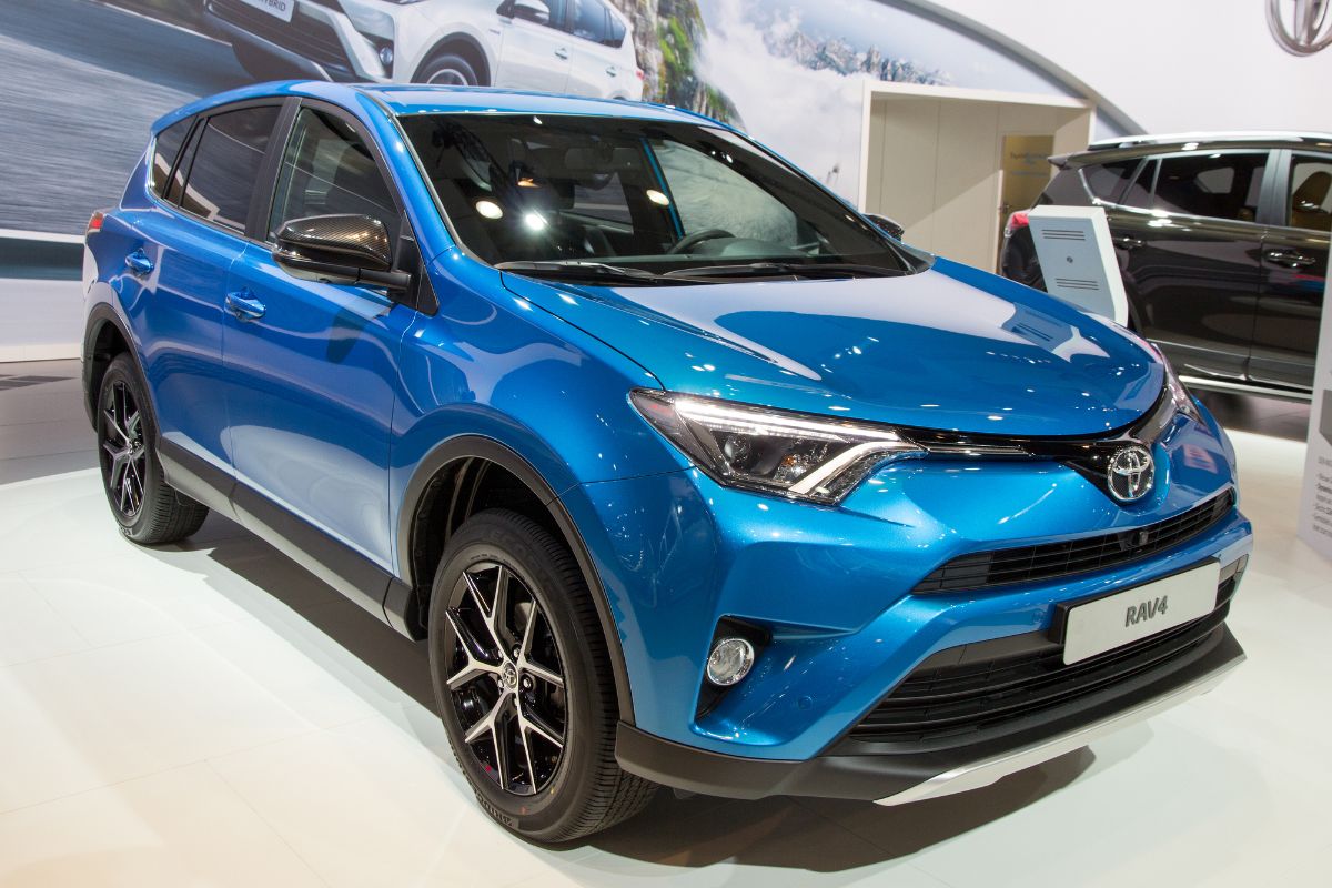 Front view of blue Toyota Rav4 Prime on car show.