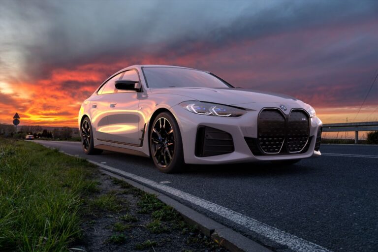 A captivating white bmw car along the road.