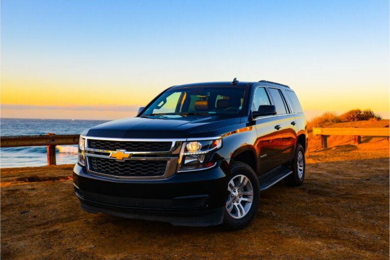 A dazzling photo of a chevy suburban black car.