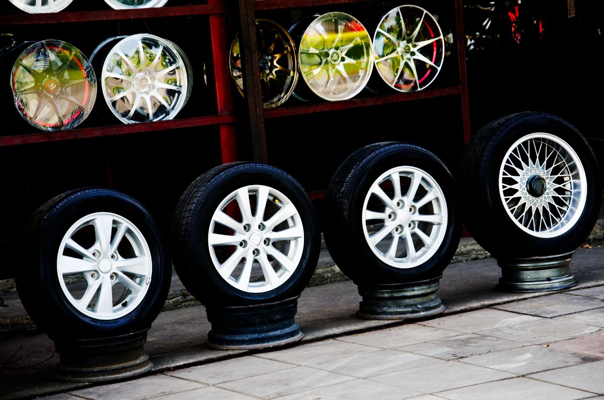 A display of different types of rims and tires.