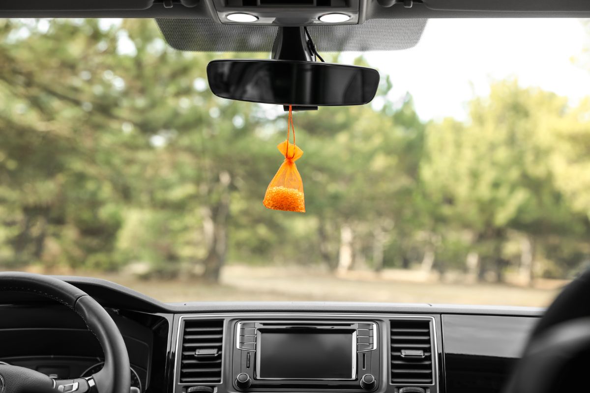 A orange hanging air freshener image.