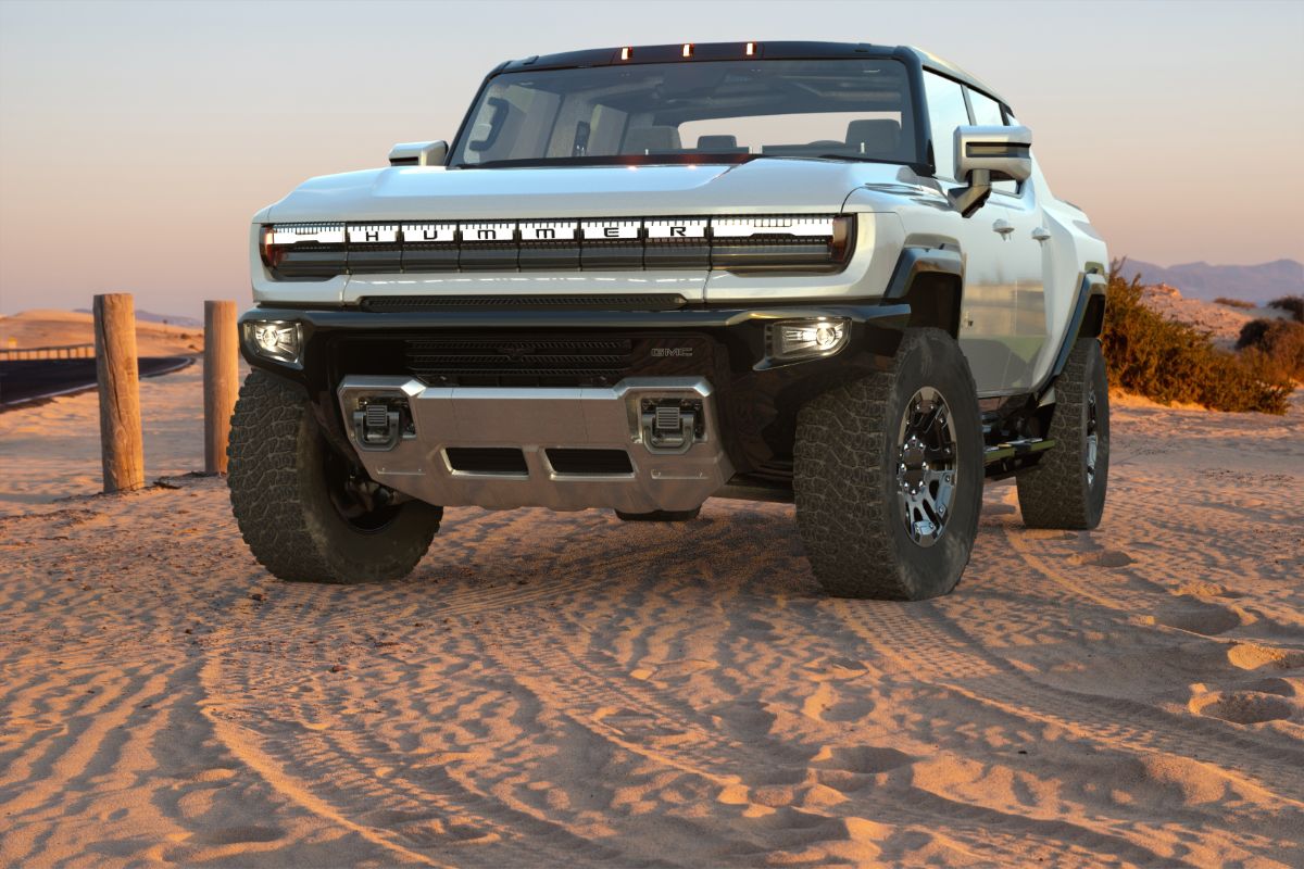 Front view shoot of a car on the sand.