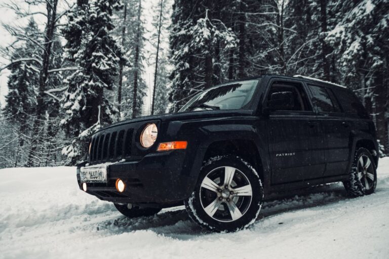 A black jeep patriot on the snow photo.