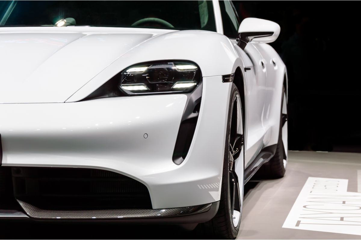 Close up front view look of a white porsche car.