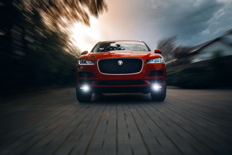 Front view look of a red jaguar car.