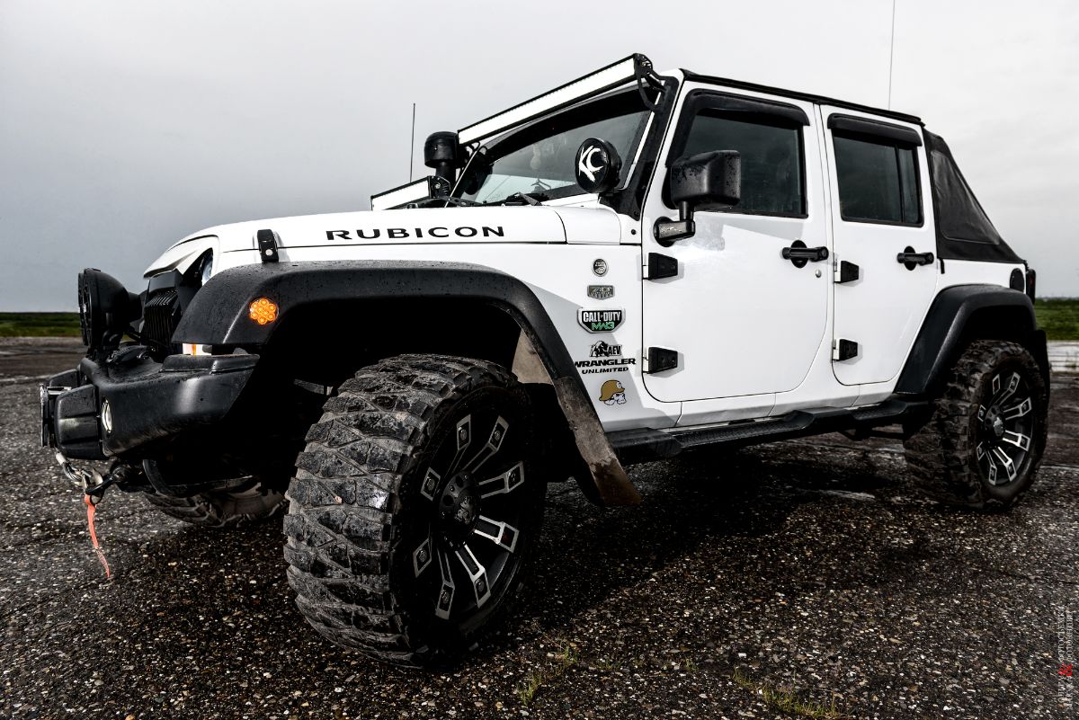 A photo of a white Jeep Wrangler.