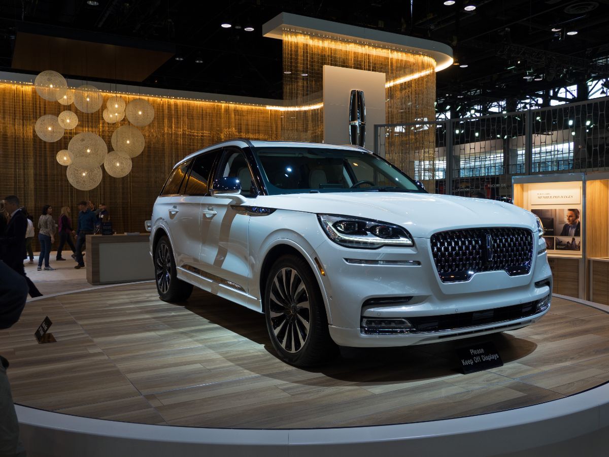 A brand new Lincoln Aviator Grand Touring Hybrid in display at a automobile show.