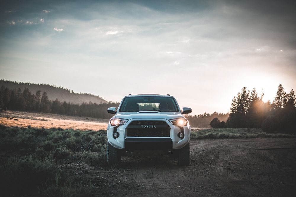 White Toyota Tundra car on muddy area.