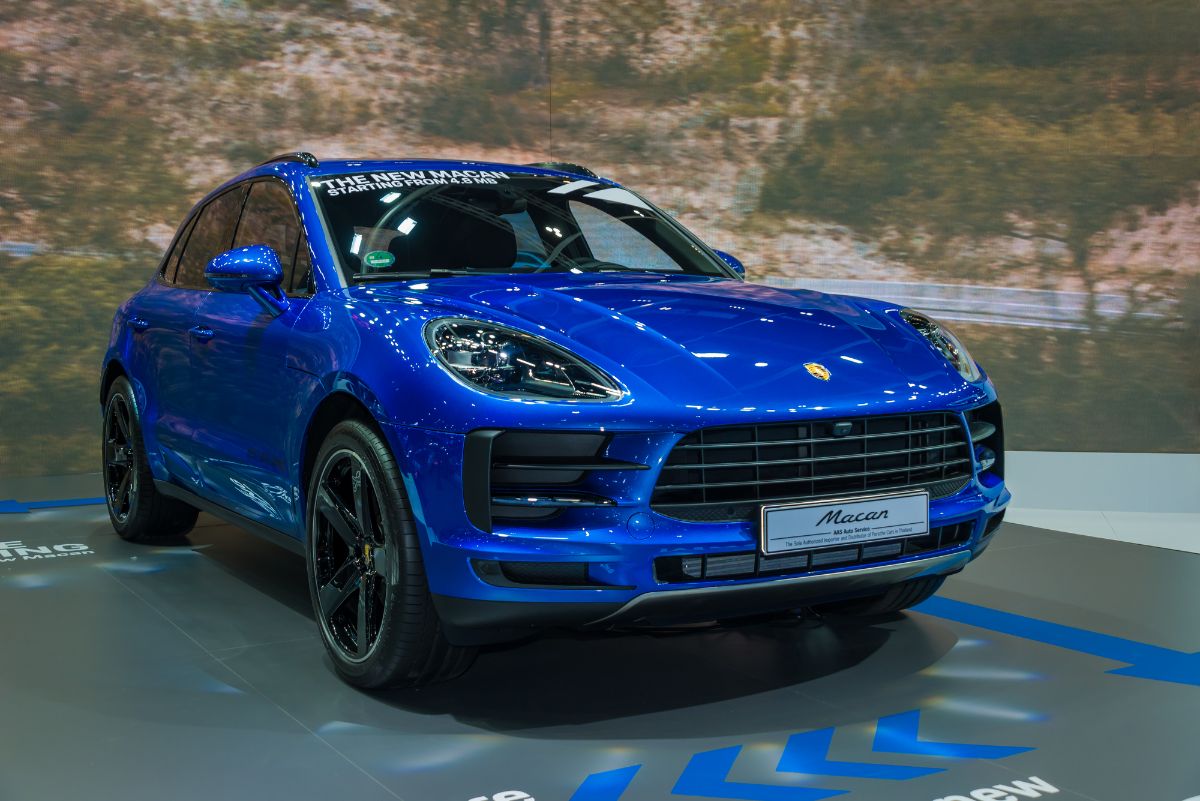 Front view of blue Porsche Macan on car show.