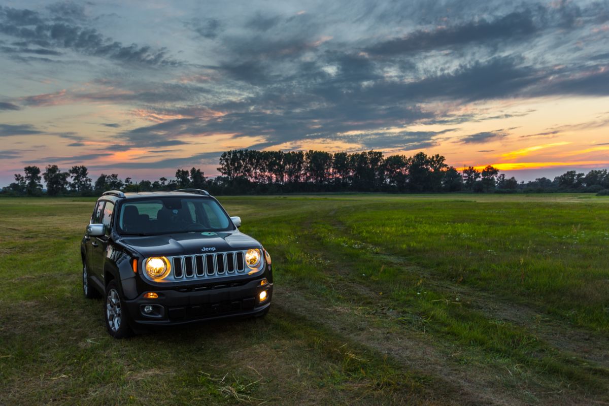 A black jeep renegade in the large open space.