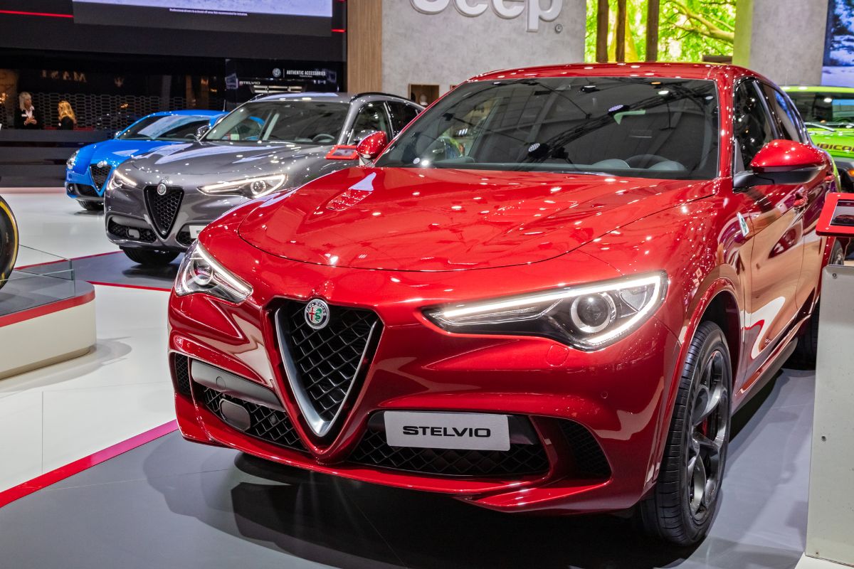 Front view of red Alfa Romeo Stelvio on car show.