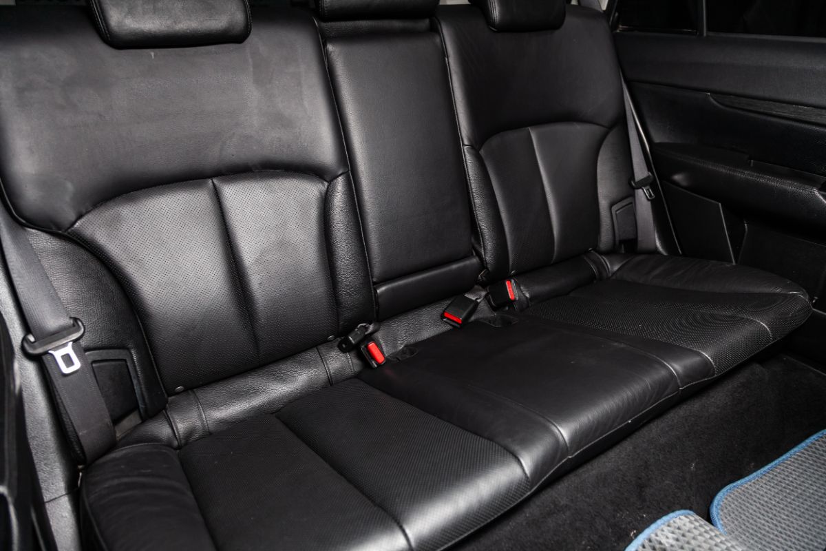 A black themed cars' interior rear seats.