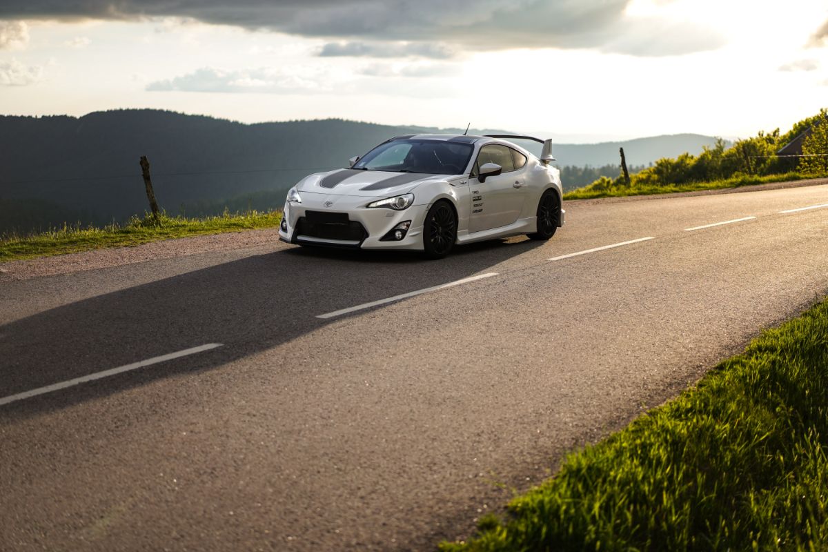 A white toyota gr86 inthe road alone.