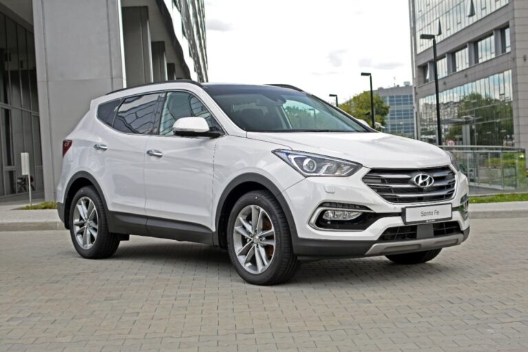 A brand new look of a white hyundai santa fe.