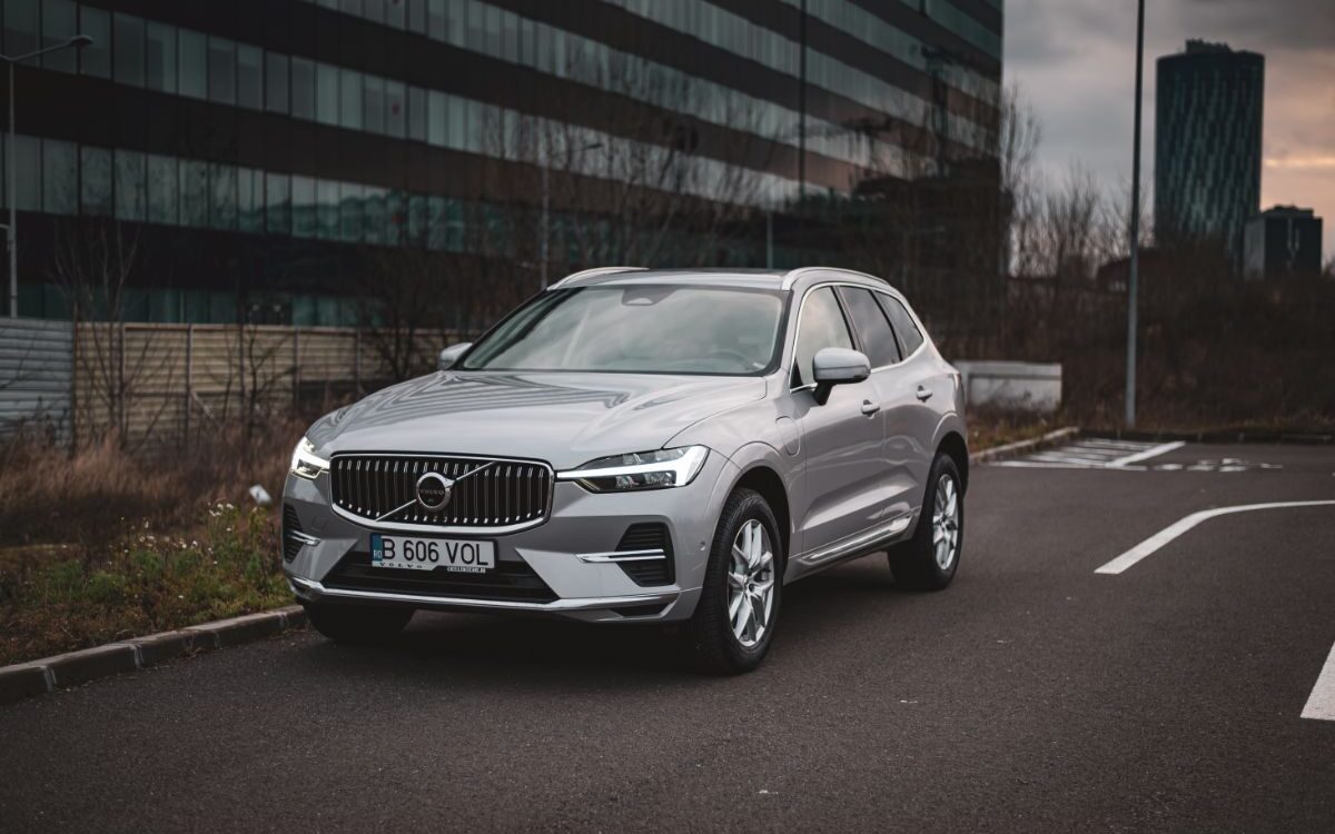 A photo of volvo xc60 car parked for recharging.