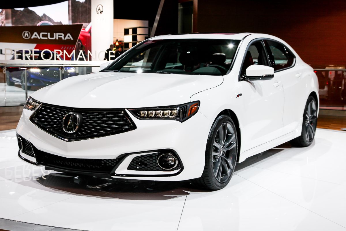 Close up photo of white acura tlx in international auto show.