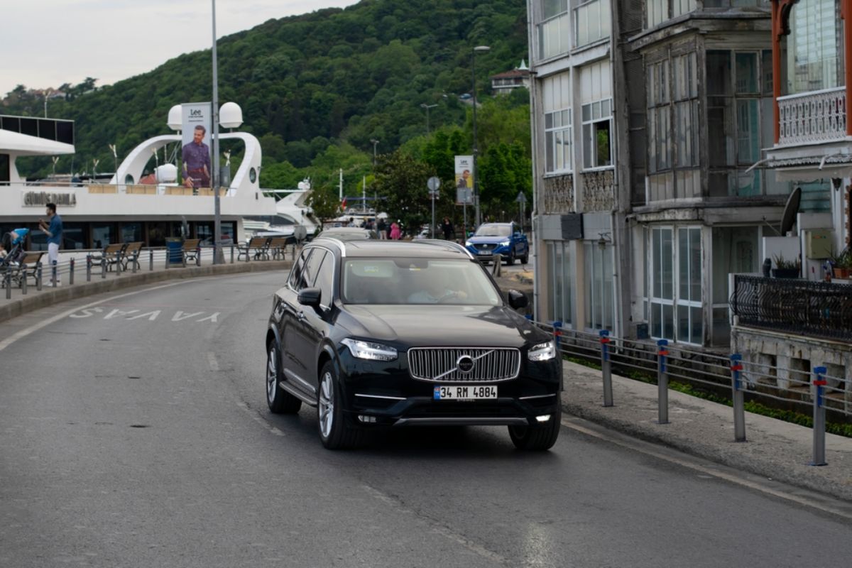 Elegant Volvo XC60 in a black colorway captured pass driving in the roads of Turkey.