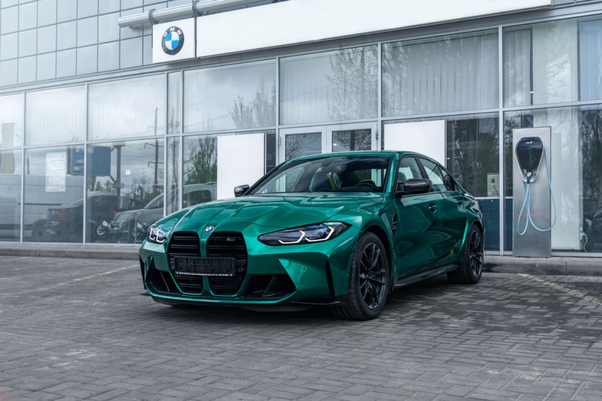 Brand new BMW M3 G80 in a mint green colorway in display at the Ford dealership store.