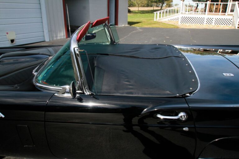 Close up photo of 1957 Ford Thunderbird with tonneau cover.