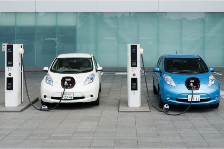 Two electric vehicles being charged at the designated electric vehicles charging station.