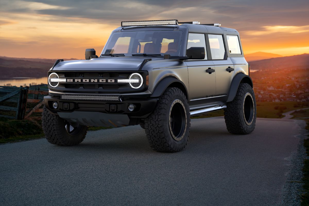 Classy and cool Ford Bronco Sport parked at a farm with a beautiful sun set at the background.