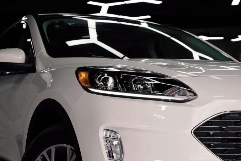 Close up photo of brand new white ford escape car.