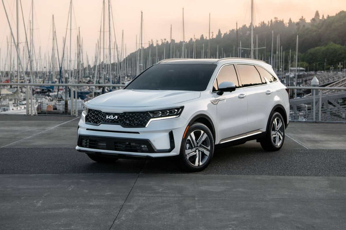 White Kia Sorento PHEV SUV photoshoot at the port flexing it's new features.