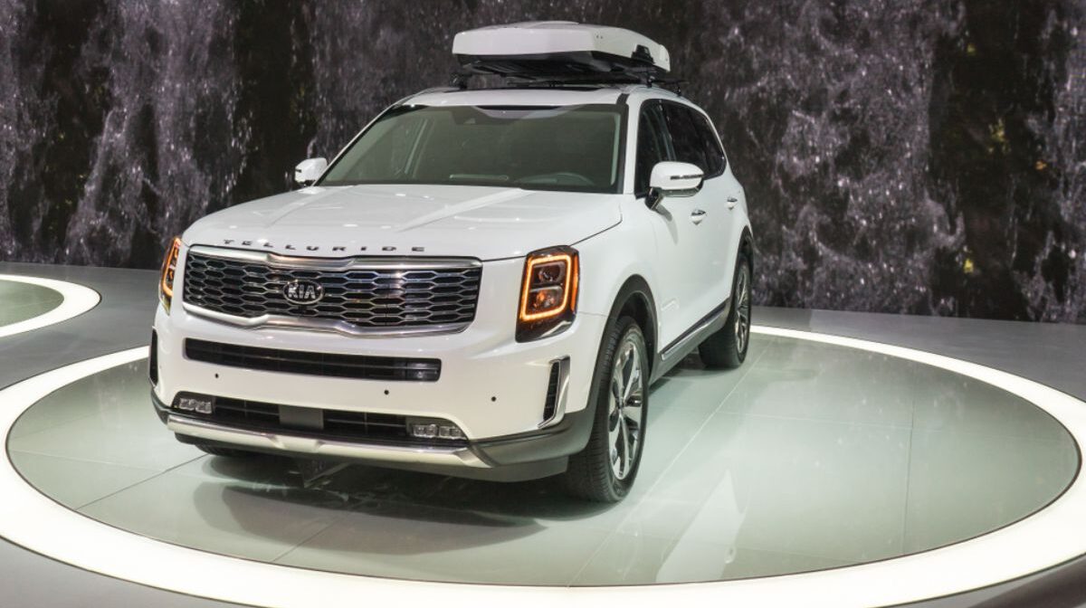 Brand new Kia Telluride in a white colorway displayed at the North American International Auto Show.