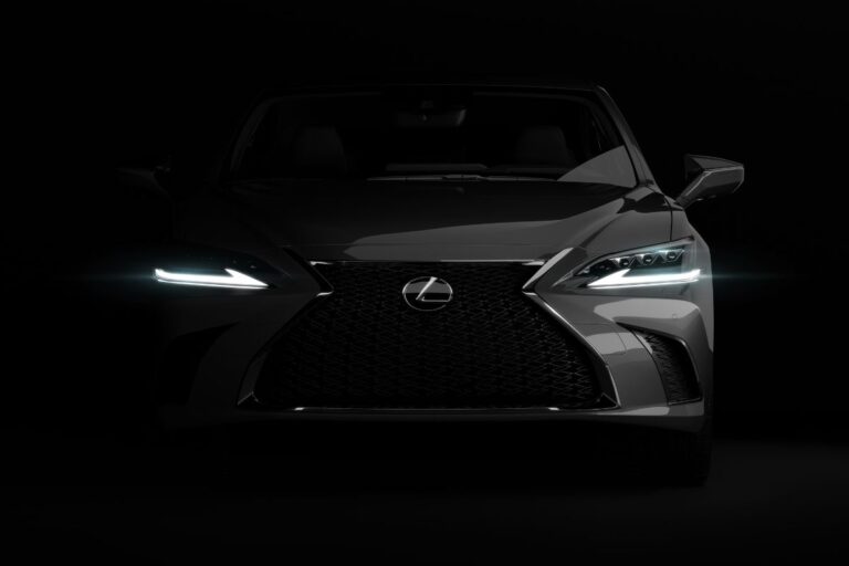 Front photo of luxury lexus es car in dark studio on black background.