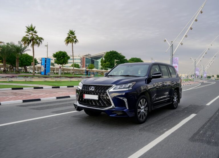 Front view photo of lexus lx car driving on the street.