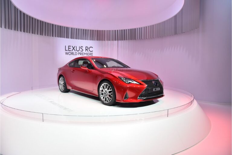 A photo of red lexus rc car displayed at motor show.