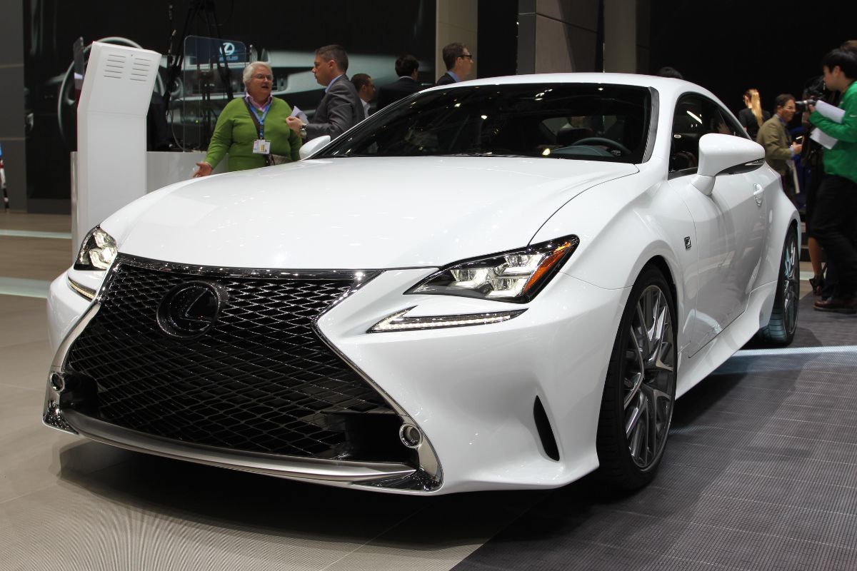 Close up photo of white lexus rc 350 displayed at the car show.